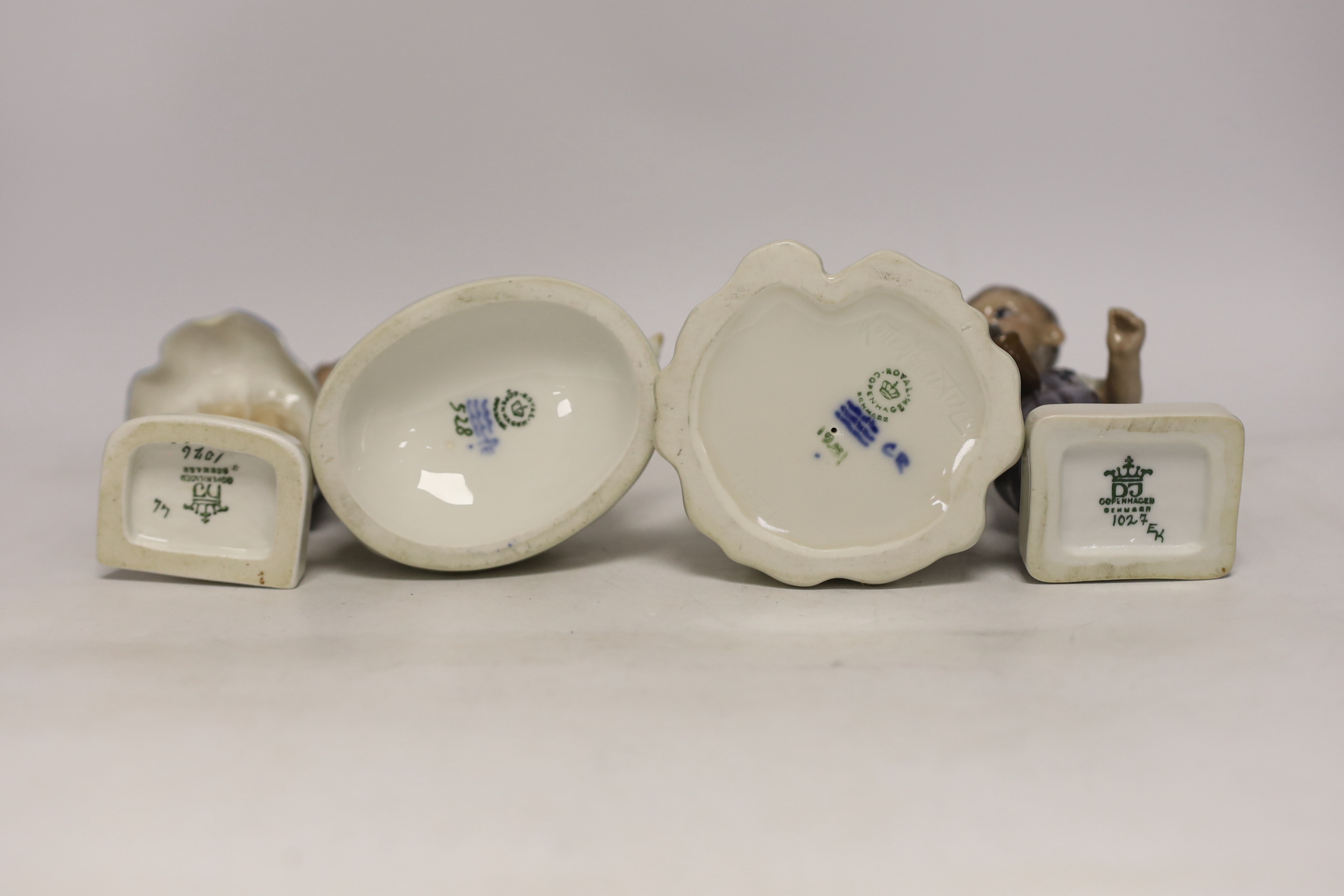 Four Royal Copenhagen figures and figurines of children, largest 19cm high